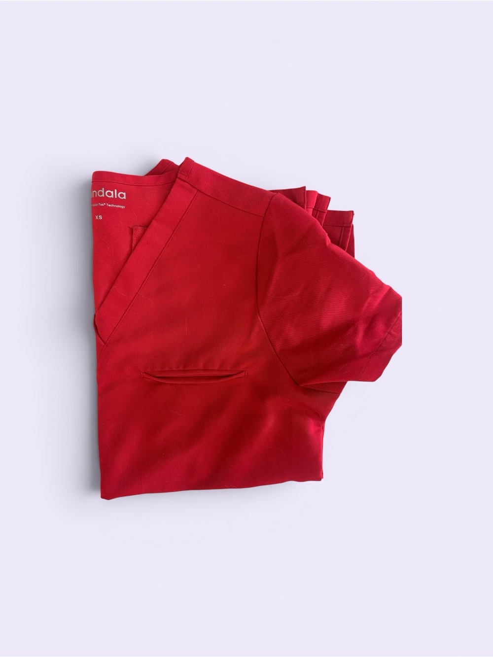 MANDALA ONE POCKET SCRUB TOP. RED. NWOT.